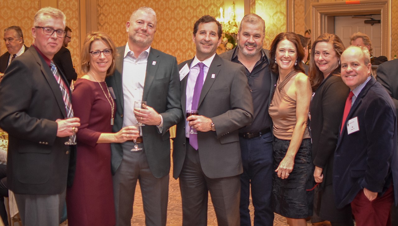 Members of the Class of 1990 celebrate the season at The Madison Hotel.