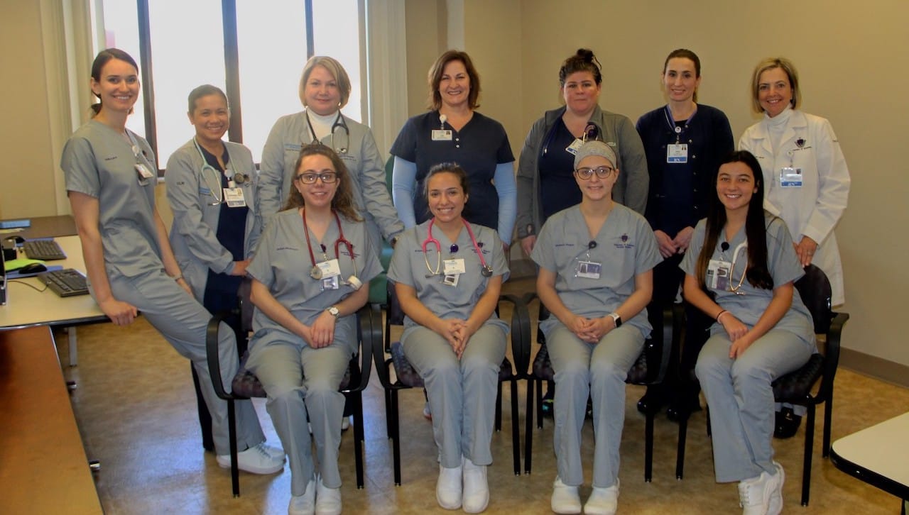 The University of Scranton’s ongoing Clinical Liaison Nurse Academic Practice Partnership with Regional Hospital of Scranton received support through the Strategic Initiatives Funding Program for the 2018-19 academic year. Front row, from left are: University student nurses Jacklyn McGovern, Bellmore, New York; Brianna Maglio, Garden City, New York; Madison Negast, Branchburg, New Jersey; and Isabella Defalcis, Orefield. Second row are, University student nurse Emily Acker, Highland Lakes, New Jersey; and Regional Hospital of Scranton nurses Mardonna Escritor; Cindy Stone, adjunct faculty member; Liza Pfaeffle; Devon Conaboy; and Laura Dougher; and Sharon Hudacek, Ed.D., professor of nursing at the University.