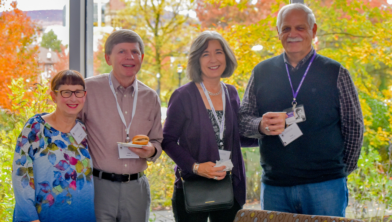 Chemistry majors reunite in the Loyola Science Center at the Chemistry Alumni Reception.