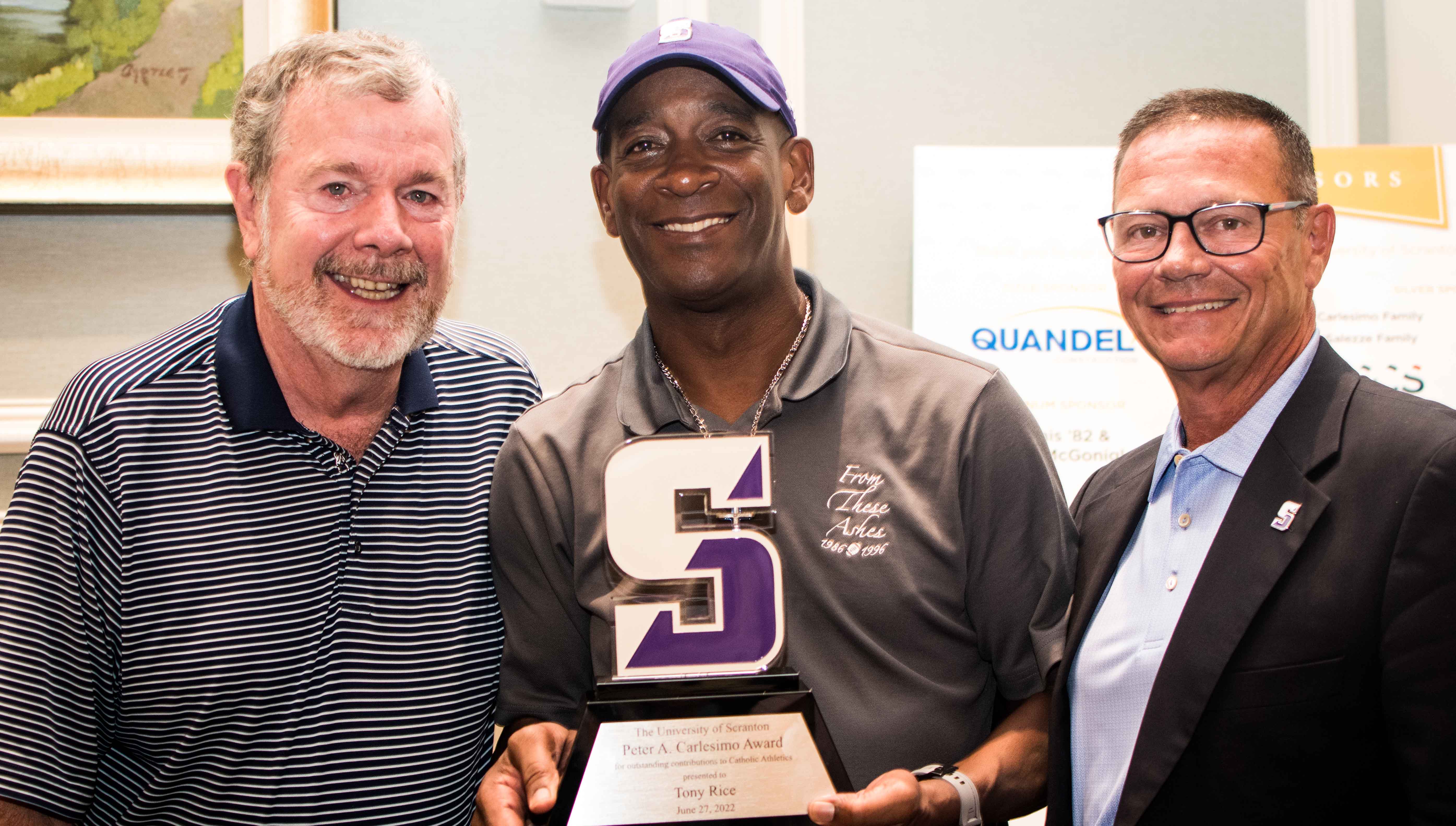 Basketball legend P.J. Carlesimo, left, and University Executive Director of Athletics Dave Martin, right, present Notre Dame legend Tony Rice with the 2022 Carlesimo Award at Canoe Brook Country Club June 27.
