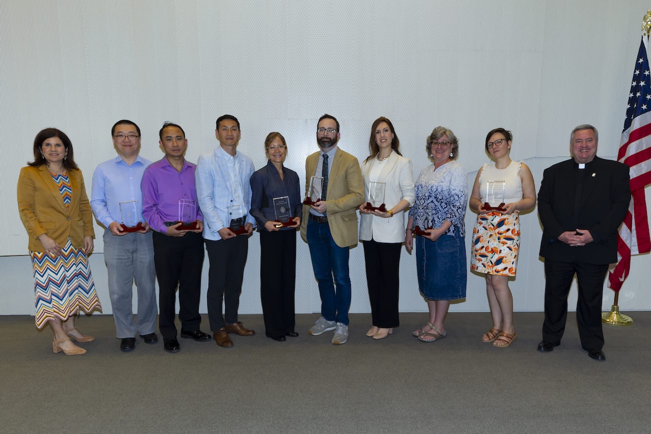 Ten University of Scranton faculty members were honored with Provost Faculty Enhancement awards for excellence in teaching, scholarship or service for 2023. From left are: Michelle Maldonado, Ph.D., provost and senior vice president for academic affairs; award recipients Jinghan Cai, Ph.D.; Gerard Dumancas, Ph.D.; Sinchul Back, Ph.D.; Patricia Wisniewski, Ed.D.; Adam Pratt; Collen Farry; Jean Harris, Ph.D.; and Amelia Randich, Ph.D.; and Rev. Joseph Marina, S.J., president. Absent from the photo were Joyanna Hopper, Ph.D., and Ann Royer, Ph.D.